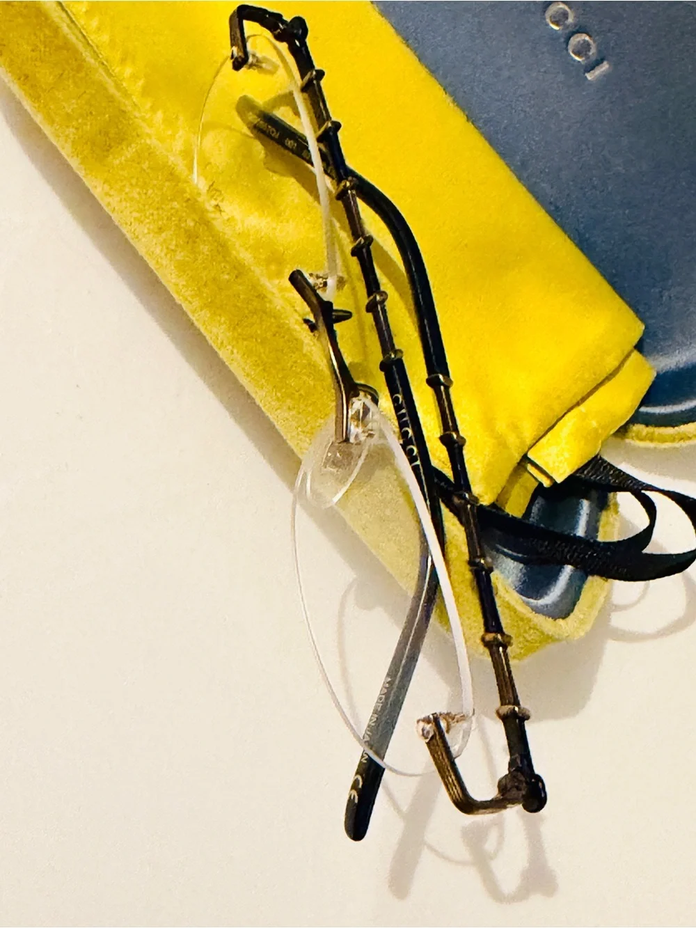 Gucci Rimless Men's Glasses in Black and Gold Accents